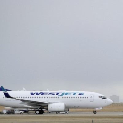 A Westjet Boeing 737-700 takes off at the International Airport in Calgary, Alberta, May 3, 2011. WestJet Airlines Ltd, Canada's No. 2 carrier, reported a 20-fold jump in quarterly earnings on Tuesday, lifting its stock, as fare increases introduced 
