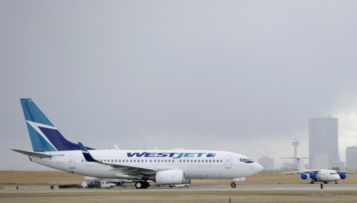 A Westjet Boeing 737-700 takes off at the International Airport in Calgary, Alberta, May 3, 2011. WestJet Airlines Ltd, Canada's No. 2 carrier, reported a 20-fold jump in quarterly earnings on Tuesday, lifting its stock, as fare increases introduced 