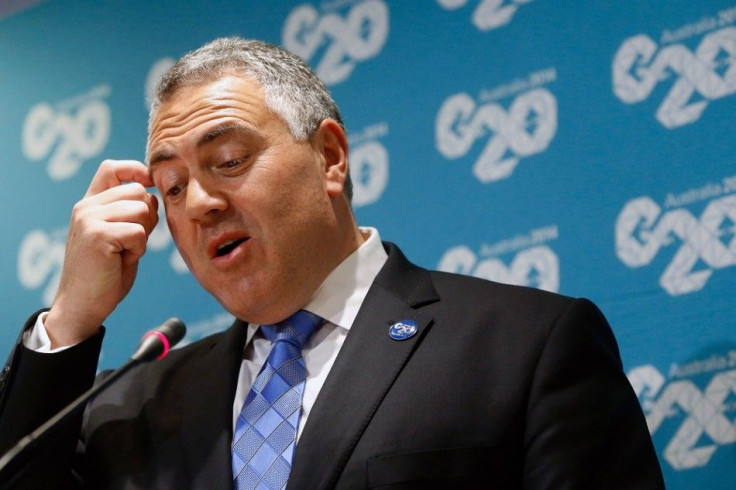 Australia's Treasurer Joe Hockey holds a news conference after a meeting of G-20 finance ministers and central bank governors during the IMF-World Bank annual meetings in Washington October 10, 2014.