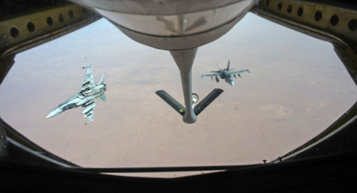 Royal Canadian Air Force CF-18 Hornets depart after refueling with a KC-135 Stratotanker assigned to the 340th Expeditionary Air Refueling Squadron over Iraq October 30, 2014. The jets are part of the Canadian Armed Forces&#039; contribution to coalition 