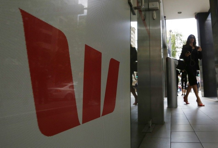 A customer walks from a Westpac bank branch in Sydney November 3, 2014. Australia's Westpac Banking Corp booked a fifth straight year of record profit with an 8 percent rise in full-year cash earnings on robust loan growth and declines in bad debts.