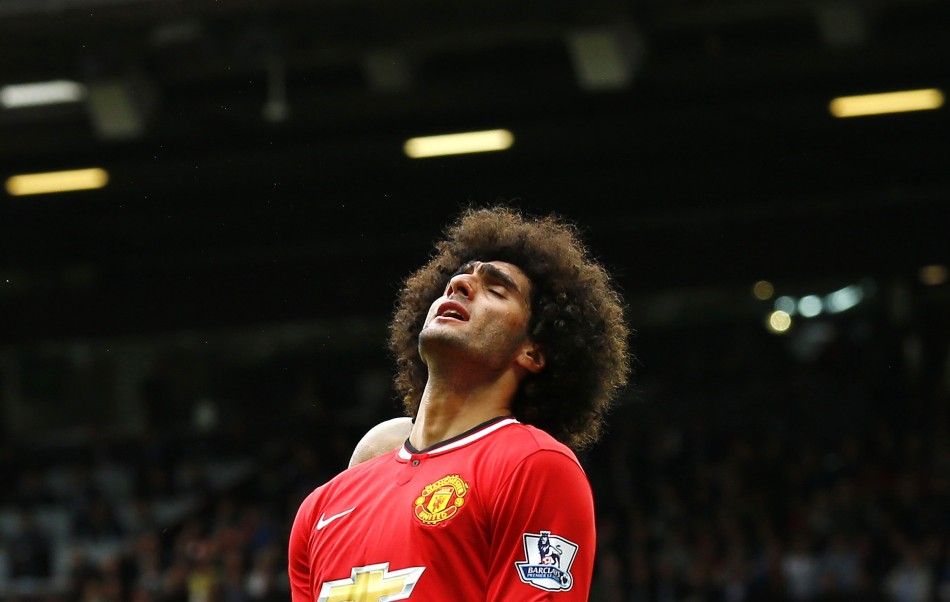 Manchester Uniteds Marouane Fellaini reacts during their English Premier League soccer match against Swansea City at Old Trafford in Manchester, northern England August 16, 2014.