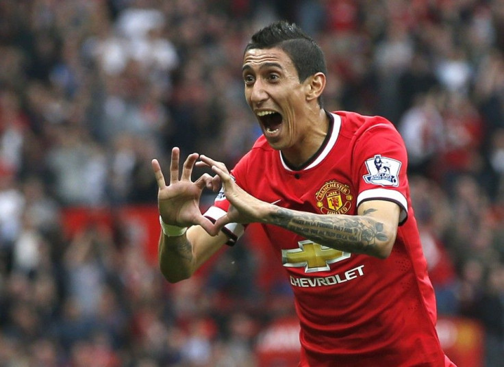 Manchester United's Angel Di Maria celebrates after scoring a goal against Queens Park Rangers during their English Premier League soccer match at Old Trafford in Manchester, northern England September 14, 2014.