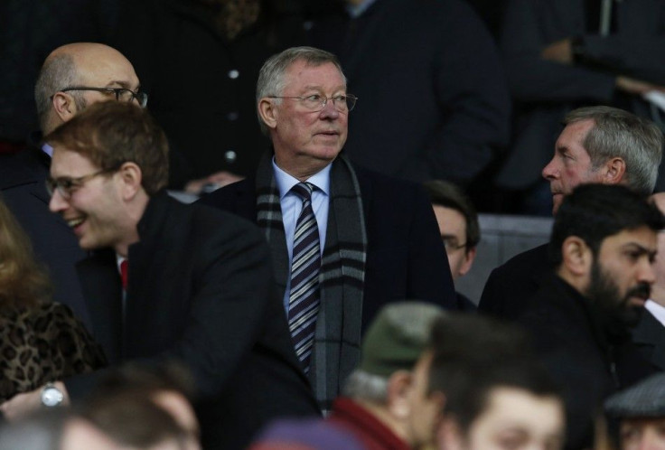 Former Manchester United manager Alex Ferguson (C) takes his seat before their English Premier League soccer match against Liverpool at Old Trafford in Manchester, northern England December 14, 2014.