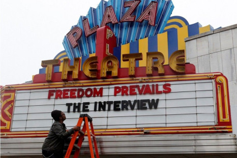 General Manager Brandon Delaney looks up at the marquee sign after the announcement that the Plaza Theatre would be showing the movie &quot;The Interview&quot; beginning Christmas Day in Atlanta