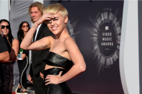 Miley Cyrus arrives at the 2014 MTV Music Video Awards in Inglewood