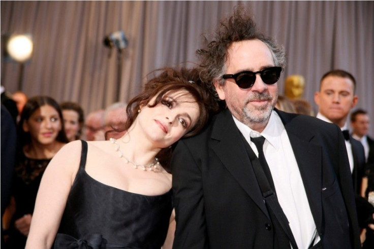 British actress Helena Bonham Carter rests her head on the shoulder of her partner director Tim Burton