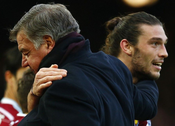 West Ham United manager Sam Allardyce congratulates Andy Carroll after he scored his second goal against Swansea City during their English Premier League soccer match at Upton Park in London, December 7, 2014.