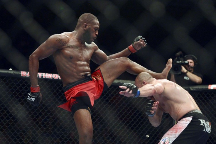 Apr 26, 2014; Baltimore, MD, USA; Glover Teixeira ducks under a kick from Jon Jones during the UFC light heavy weight championship fight at Baltimore Arena. Jones retained the light heavy weight championship by defeating Teixeria.