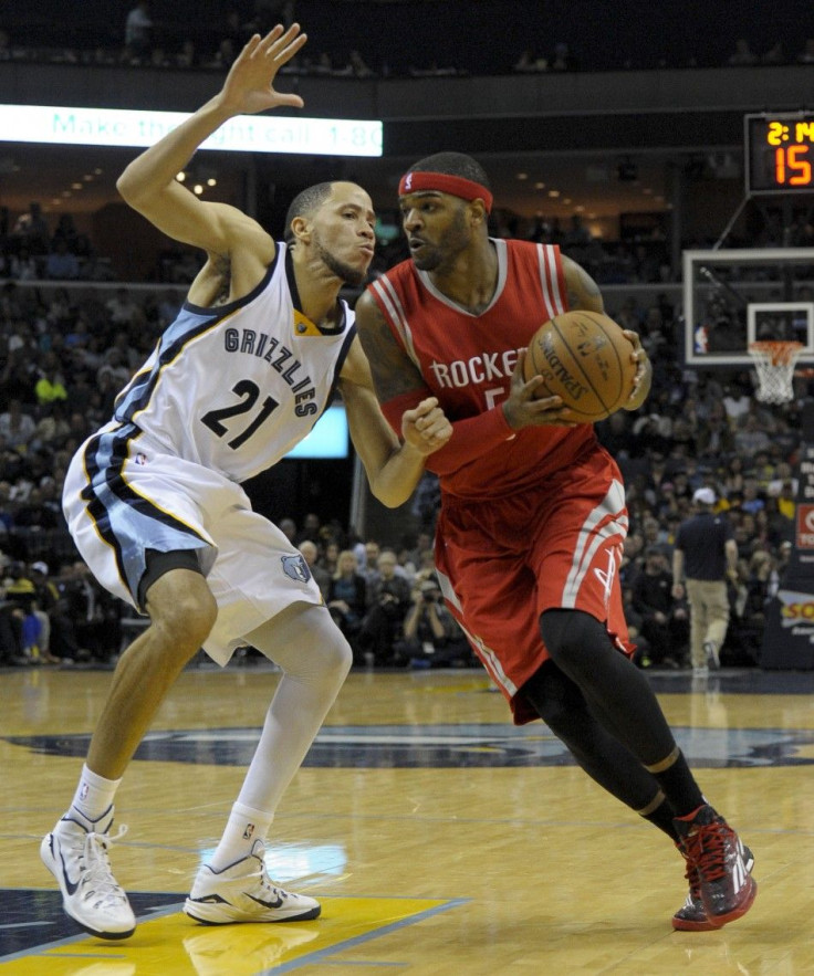 Dec 26, 2014; Memphis, TN, USA; Houston Rockets forward Josh Smith (5) drives to the basket against Memphis Grizzlies forward Tayshaun Prince (21) during the game at FedExForum. Houston Rockets beat Memphis Grizzlies 117 - 111.