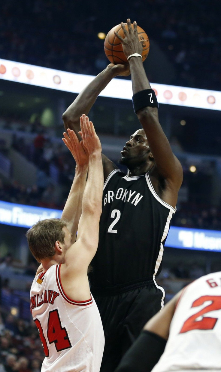 Dec 10, 2014; Chicago, IL, USA; Brooklyn Nets forward Kevin Garnett (2) shoots over Chicago Bulls forward Mike Dunleavy (34) during the first half of their NBA game at United Center.