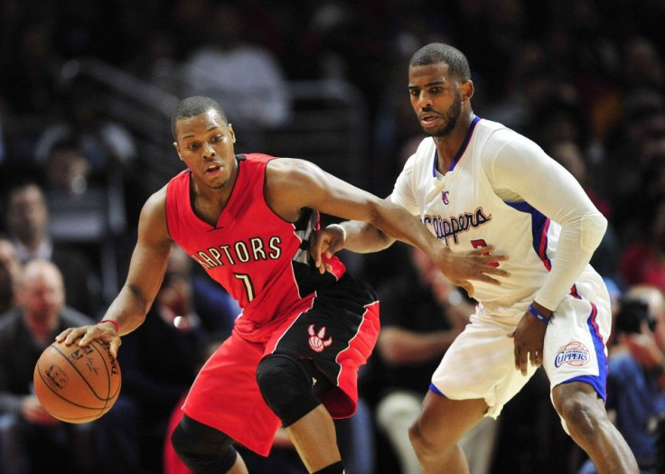 December 27, 2014; Los Angeles, CA, USA; Toronto Raptors guard Kyle Lowry (7) controls the ball against the defense of Los Angeles Clippers guard Chris Paul (3) during the second half at Staples Center.