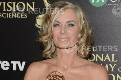 Eileen Davidson holds her award for outstanding lead actress in a drama series for her role on &quot;Days of Our Lives&quot; as she poses backstage during the 41st Annual Daytime Emmy Awards in Beverly Hills, California June 22, 2014.