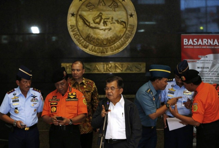 Indonesia's vice-president Jusuf Kalla (C) speaks to the media regarding AirAsia Flight QZ8501 during a visit to the National Search and Rescue Agency in Jakarta December 28, 2014. Indonesia's air force was searching for an AirAsia plane carrying 162 peop