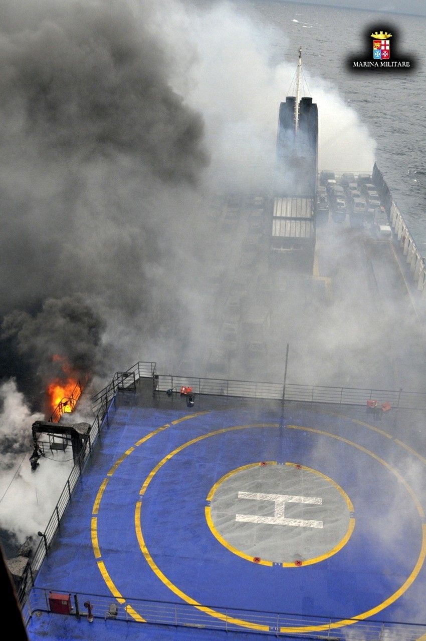 The car ferry Norman Atlantic burns in waters off Greece December 28, 2014 in this handout photo provided by Marina Militare. Italian and Greek helicopter crews prepared to work through the night to airlift passengers in pairs off a burning ferry adrift i
