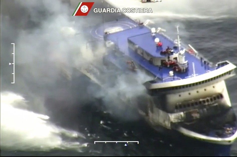 The car ferry Norman Atlantic burns in waters off Greece December 28, 2014 in this handout video grab of the Italian Coast Guard. Italian and Greek helicopter crews prepared to work through the night to airlift passengers in pairs off a burning ferry adri