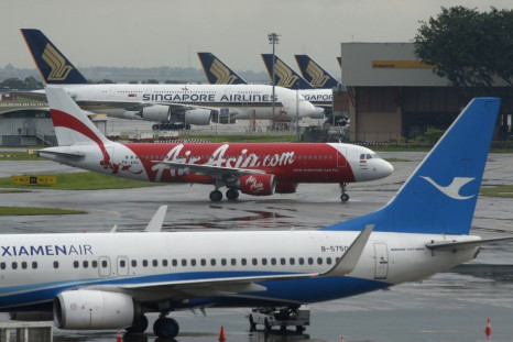 AirAsia's QZ8501 from Surabaya to Singapore, taking the same code as the missing plane which took off 24 hours earlier, taxis at Changi Airport in Singapore December 29, 2014. Indonesia was set to resume at first light the search for an AirAsia plane