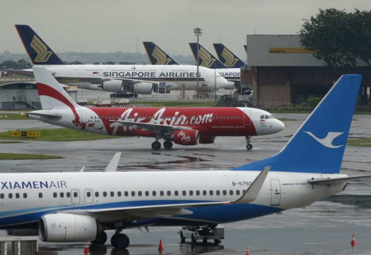 AirAsia's QZ8501 from Surabaya to Singapore, taking the same code as the missing plane which took off 24 hours earlier, taxis at Changi Airport in Singapore December 29, 2014. Indonesia was set to resume at first light the search for an AirAsia plane
