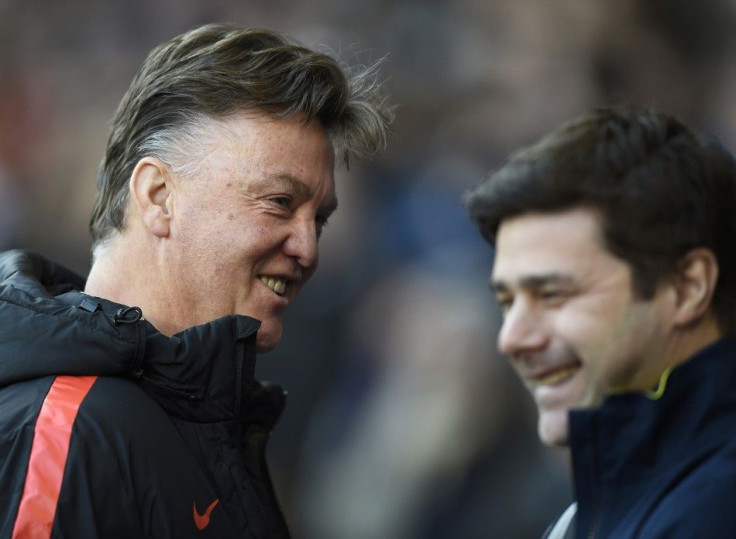 Tottenham Hotspur manager Mauricio Pochettino (R) speaks to Manchester United manager Louis van Gaal before their English Premier League soccer match at White Hart Lane in London December 28, 2014.