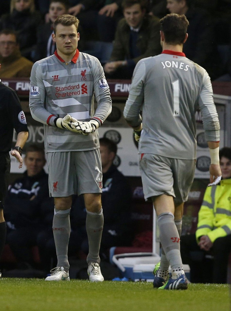 Liverpool's Simon Mignolet (L) replaces Brad Jones during their English Premier League soccer match at Turf Moor in Burnley, northern England December 26, 2014.