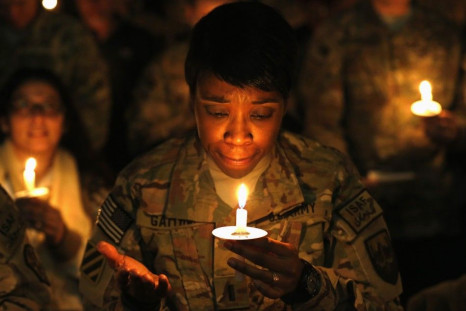 U.S. troops from the Nato-led International Security Assistance Force (ISAF) light candles