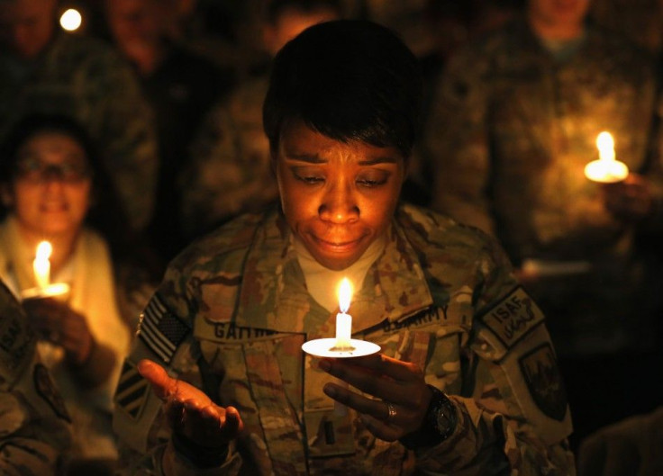 U.S. troops from the Nato-led International Security Assistance Force (ISAF) light candles