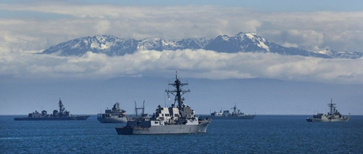 Naval ships from several countries anchor off shore while taking part in ceremonies marking the Canadian Navy's 100th anniversary in Victoria, British Columbia June 11, 2010. The ships are (L-R) Japan's JDS Atago, New Zealand's HMNZS Endeavour, United Sta