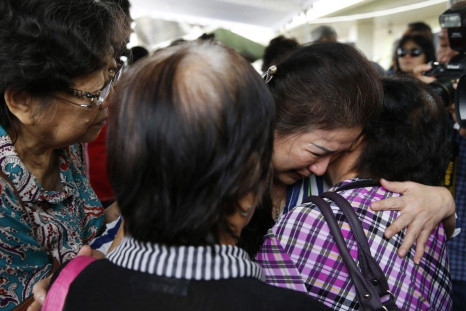 Relatives of passengers onboard AirAsia flight QZ8501 cry in a waiting area at Juanda International Airport in Surabaya December 29, 2014. A missing AirAsia jet carrying 162 people could be at the bottom of the sea after it was presumed to have crashed of