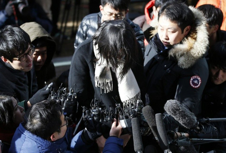 Cho Hyun-ah, also known as Heather Cho, daughter of chairman of Korean Air Lines, Cho Yang-ho, is surrounded by media upon her arrival at the Seoul Western District Prosecutor's Office in Seoul December 17, 2014. South Korea's transport ministry said on T