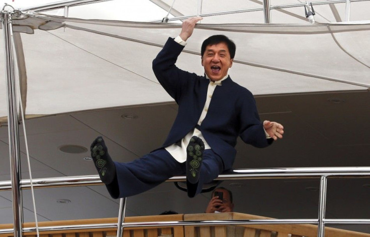 Actor Jackie Chan jokes from the deck of a yacht