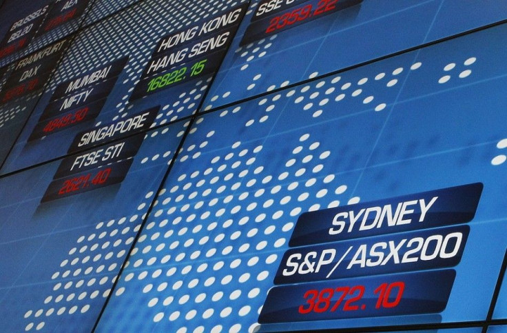 The main indicator of the Australian Securities Exchange (bottom R) is seen in red shortly after the local market opened in Central Sydney October 4, 2011. Australian stocks eased 0.6 percent on Tuesday, pressured by falls in global equities markets in a 