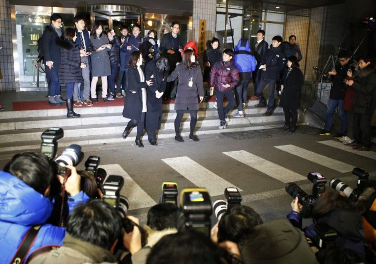 Cho Hyun-ah (C), also known as Heather Cho, daughter of chairman of Korean Air Lines, Cho Yang-ho, leaves for a detention facility after a court ordered her to be detained, at the Seoul Western District Prosecutor?s office December 30, 2014. South Korean 