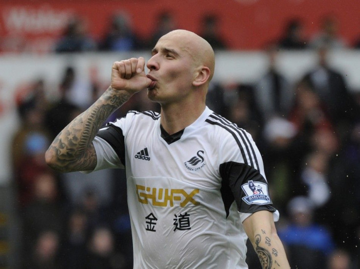 Swansea City's Jonjo Shelvey celebrates scoring a goal against Aston Villa during their English Premier League soccer match at the Liberty Stadium in Swansea, Wales, April 26, 2014.