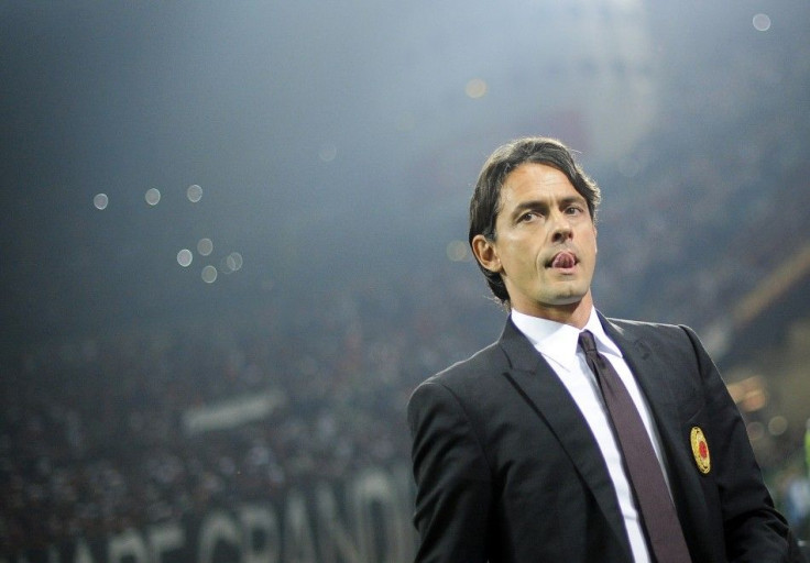 AC Milan coach Filippo Inzaghi looks on before the start of their Italian Serie A soccer match against Juventus at the San Siro stadium in Milan September 20, 2014.
