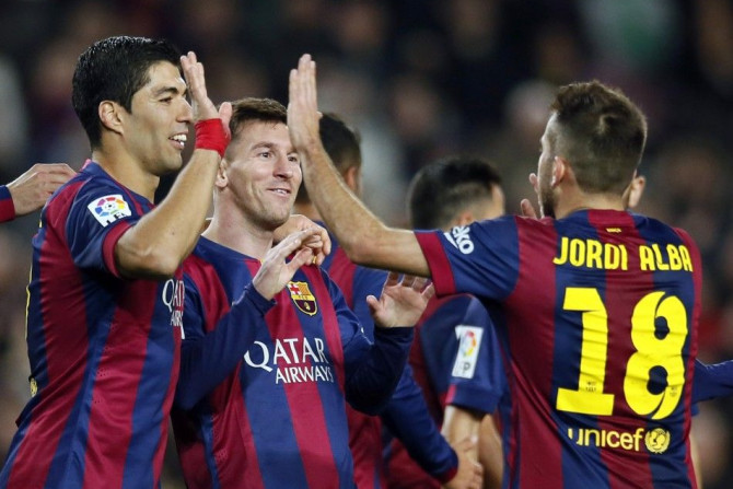 Barcelona&#039;s Lionel Messi (C), Luis Suarez (L) and Jordi Alba celebrate a goal against Cordoba during their Spanish First division soccer match at Camp Nou stadium in Barcelona December 20, 2014.