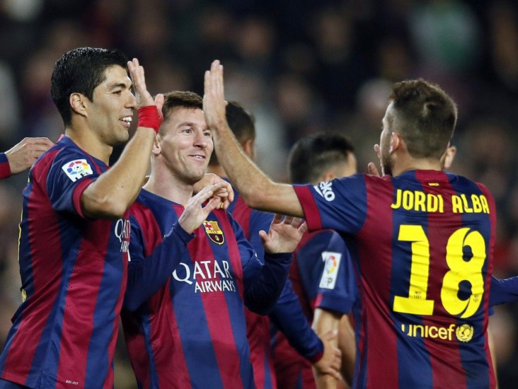 Barcelona&#039;s Lionel Messi (C), Luis Suarez (L) and Jordi Alba celebrate a goal against Cordoba during their Spanish First division soccer match at Camp Nou stadium in Barcelona December 20, 2014.