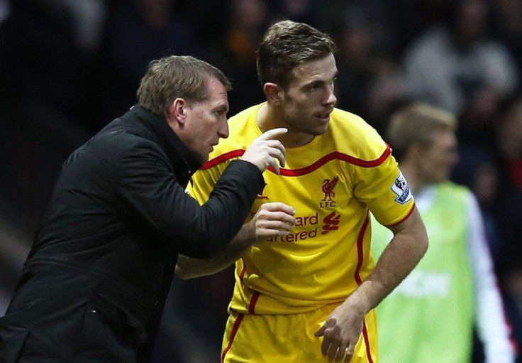 Liverpool manager Brendan Rodgers (L) instructs Jordan Henderson during their English Premier League soccer match against Manchester United at Old Trafford in Manchester, northern England December 14, 2014.