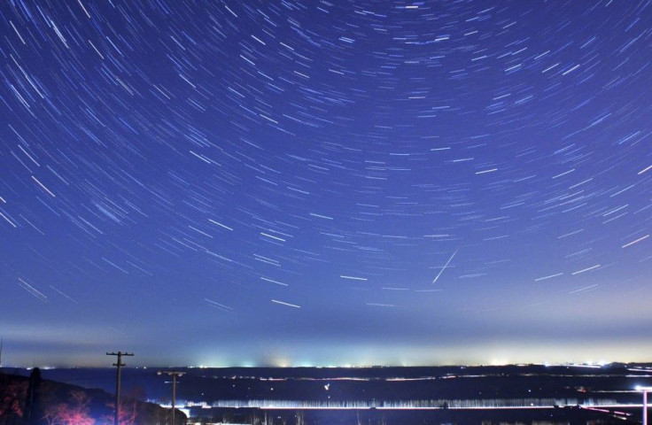A meteor streaks past stars during the annual Quadrantid meteor shower in Qingdao, Shandong province, January 4, 2014. Picture taken with a long exposure. Picture taken January 4, 2014.