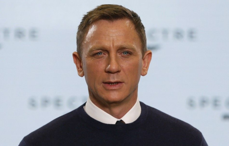 Actor Daniel Craig poses on stage