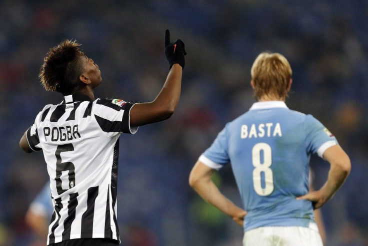 Juventus&#039; Paul Pogba (L) celebrates after scoring his second goal against Lazio during their Italian Serie A soccer match at Olympic stadium in Rome November 22, 2014.