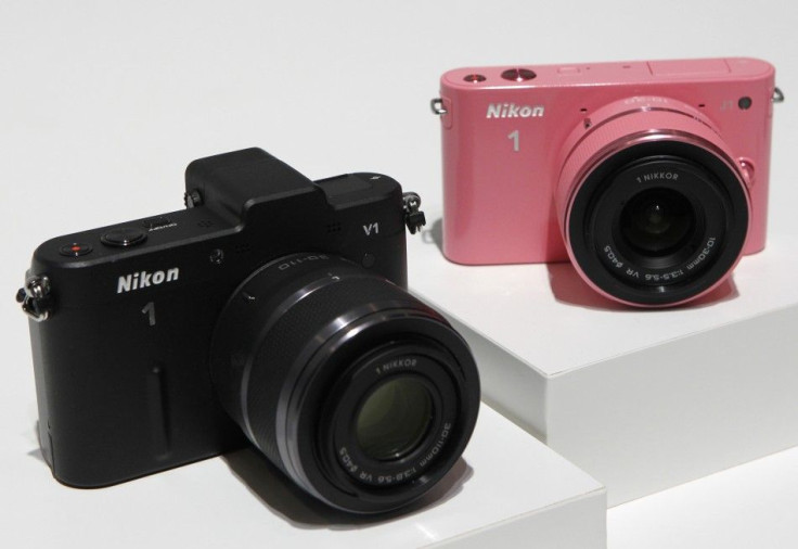 Nikon Corp&#039;s new camera Nikon 1 V1 (L) and J1 are displayed at its unveiling ceremony in Tokyo September 21, 2011. Nikon unveiled its first mirrorless cameras on Wednesday, beating its arch rival Canon to the nascent market for small, interchangeable