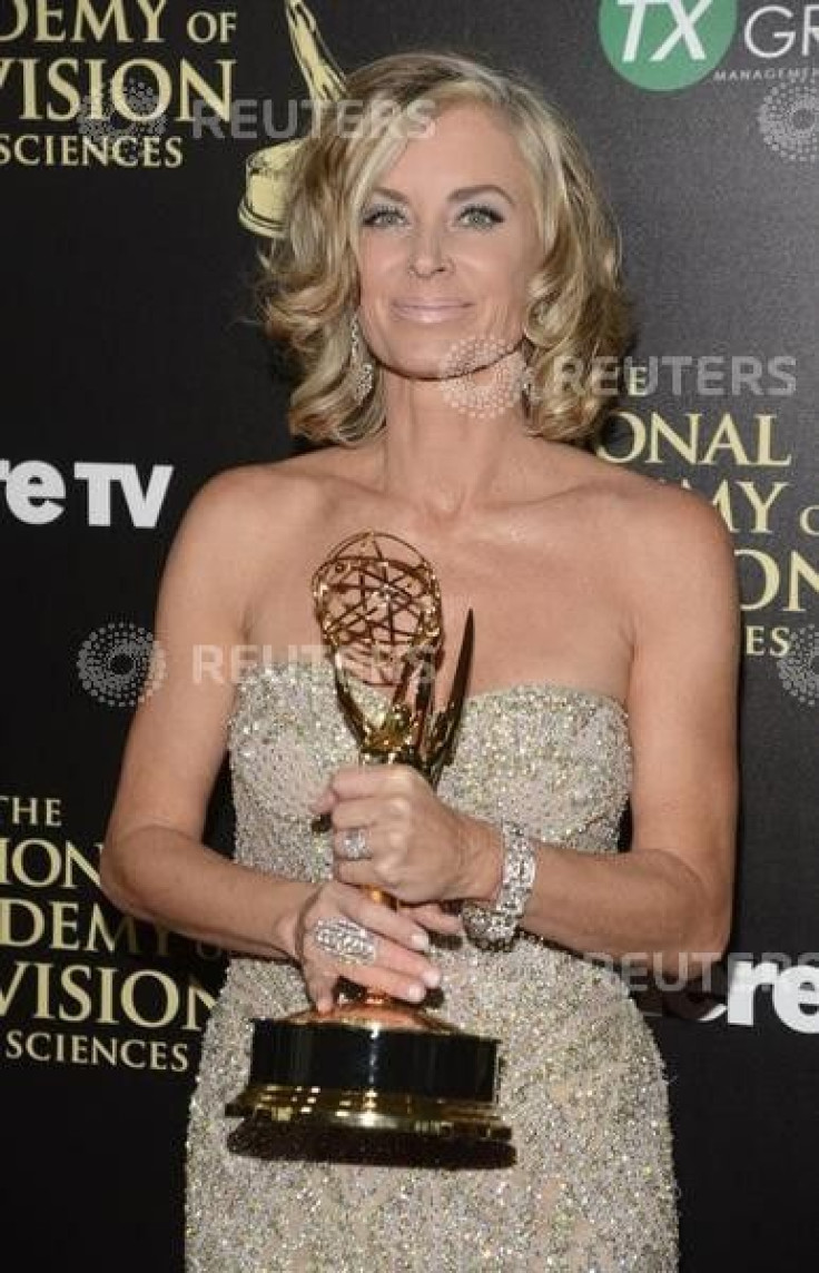 Eileen Davidson holds her award for outstanding lead actress in a drama series for her role on &quot;Days of Our Lives&quot; as she poses backstage during the 41st Annual Daytime Emmy Awards in Beverly Hills, California June 22, 2014.