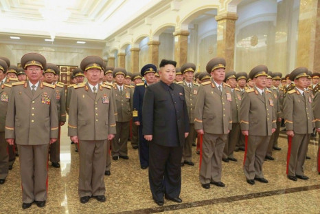 North Korean leader Kim Jong Un pays his respects to North Korean founder Kim Il Sung and his father Kim Jong Il at Kumsusan Palace of the Sun