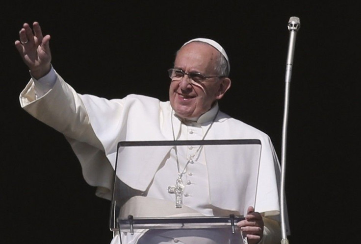 Pope Francis blesses during his Sunday Angelus prayer in Saint Peter&#039;s Square at the Vatican January 4, 2015. Pope Francis on Sunday named 20 new cardinals to the elite group at the top of the Roman Catholic hierarchy, including 15 who are under 80 a