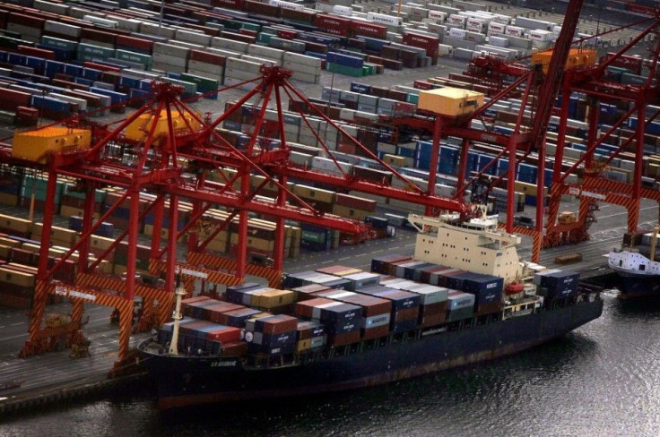 A ship is loaded with containers at Sydney's Port Botany container terminal March 4, 2013. Australia's trade deficit shrank by much more than expected in February to its smallest in 14 months thanks to higher prices for resource exports, a likely boost to