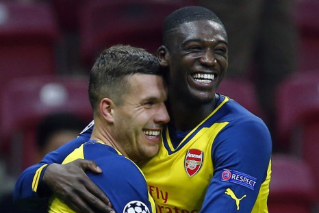Arsenal's Lukas Podolski celebrates his second goal against Galatasaray with team mate Yaya Sanogo (R) during their Champions League Group D soccer match at Ali Sami Yen Spor Kompleksi in Istanbul December 9, 2014.