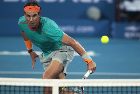 Rafael Nadal of Spain returns the ball to Andy Murray of Britain during their semi-final match at the Mubadala World Tennis Championship in Abu Dhabi January 2, 2015. REUTERS/Martin Dokoupil