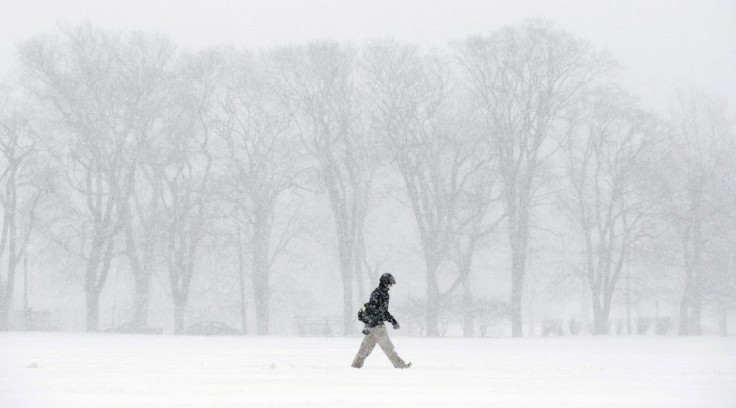 A pedestrian braves the elements during a winter storm on January 22, 2014 in Halifax, Nova Scotia. The winter weather system, which is expected to continue into the night, has battered the Atlantic provinces with gusting winds and heavy snowfall.   REUTE