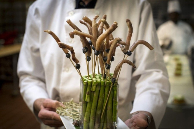 Goat penises are prepared in the kitchen before the 110th Explorers Club Annual Dinner at the Waldorf Astoria in New York March 15, 2014. Chef and exotic creator Gene Rurka led a team which created unique cuisine for the event, with dishes featuring an ar