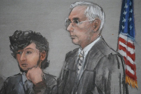 Accused Boston Marathon bomber Dzhokhar Tsarnaev is shown in a courtroom sketch next to Judge George O'Toole on the first day of jury selection at the federal courthouse in Boston